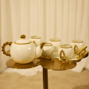 Beaded handle teacup set